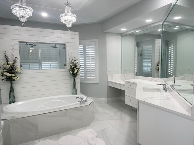 bathroom featuring a notable chandelier, vanity, and plus walk in shower