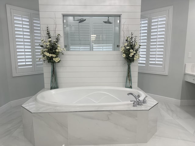 2727 Eleanor Way, Wellington, FL 33414 - bathroom featuring a tile shower, marble finish floors, a bath, and baseboards