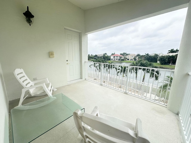 balcony featuring a water view