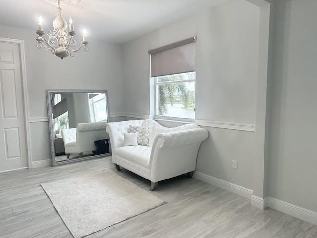 2727 Eleanor Way, Wellington, FL 33414 - sitting room featuring a chandelier, baseboards, and wood finished floors