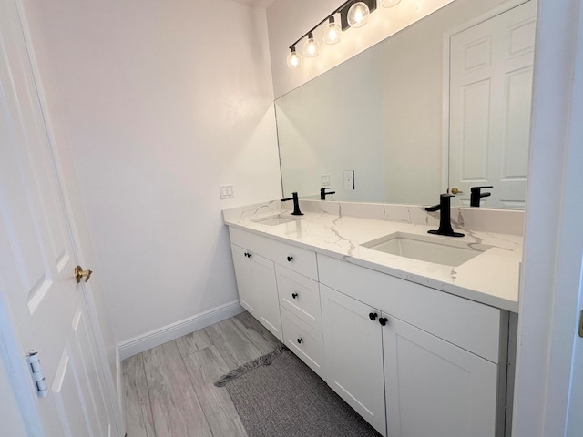 bathroom featuring wood-type flooring and vanity