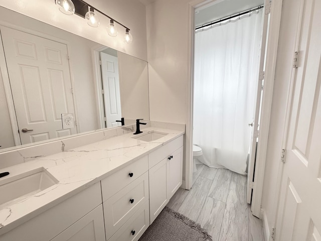 full bathroom featuring vanity, toilet, and shower / tub combo with curtain