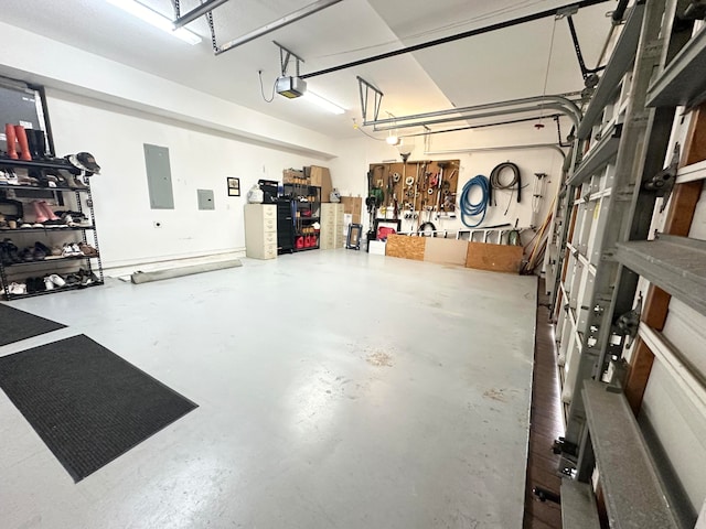 garage featuring electric panel and a garage door opener