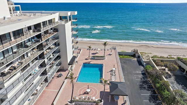 bird's eye view with a water view and a view of the beach