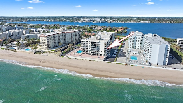 birds eye view of property with a view of city, a water view, and a view of the beach