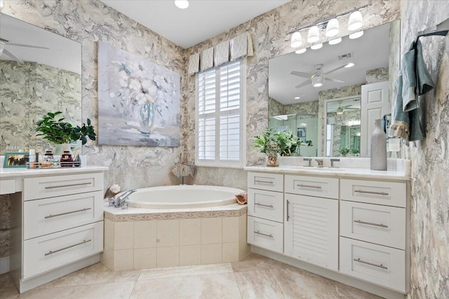 bathroom featuring vanity, ceiling fan, and independent shower and bath