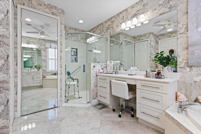 bathroom with ceiling fan, vanity, and independent shower and bath