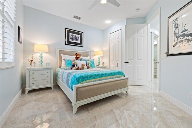 bedroom with ceiling fan and a closet