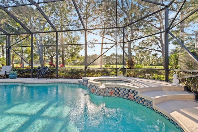 view of pool featuring glass enclosure and an in ground hot tub