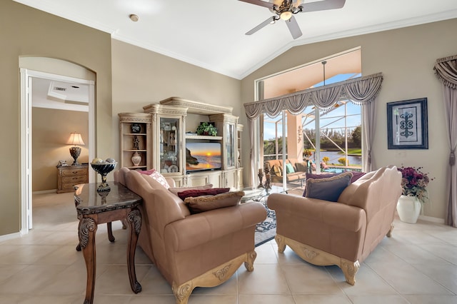 living room with ceiling fan, light tile patterned flooring, lofted ceiling, and crown molding