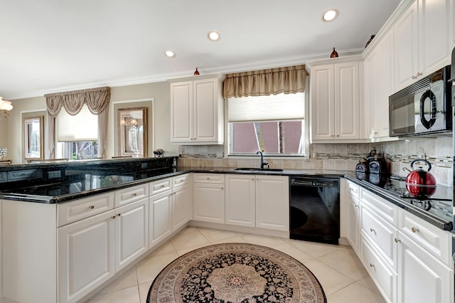 kitchen with black appliances, plenty of natural light, white cabinets, and sink