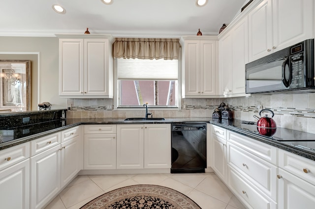 kitchen featuring tasteful backsplash, ornamental molding, sink, black appliances, and white cabinetry