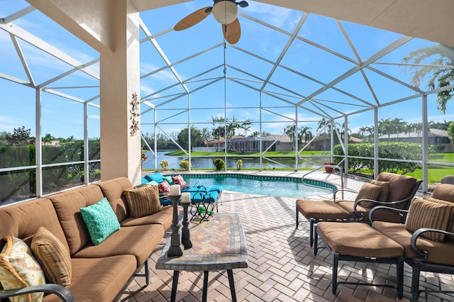 view of swimming pool with a lanai, an outdoor living space, a water view, and a patio