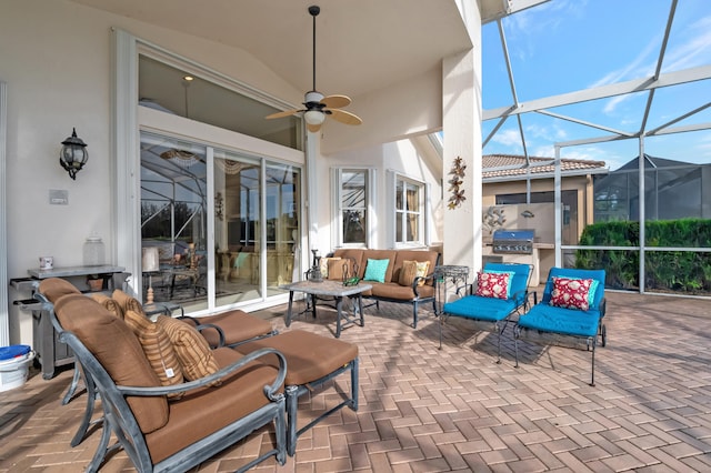 view of patio / terrace featuring an outdoor living space, ceiling fan, and a lanai