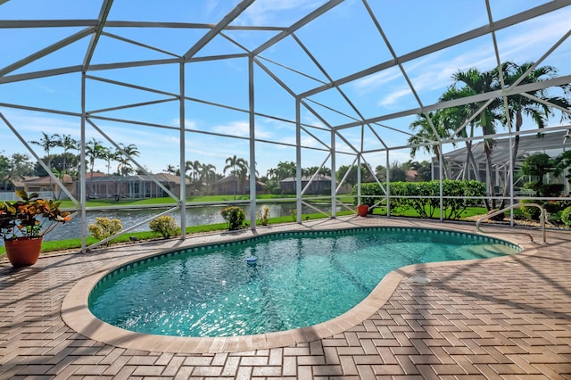 view of swimming pool featuring a water view, a patio area, and a lanai