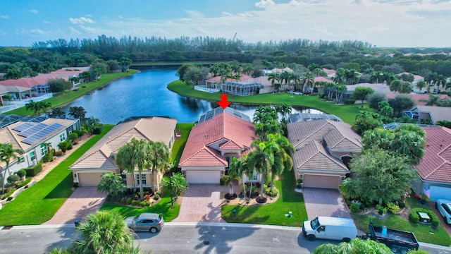 birds eye view of property with a water view