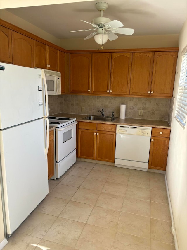 kitchen featuring ceiling fan, sink, backsplash, white appliances, and light tile patterned floors