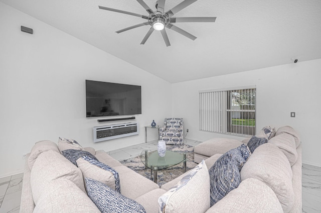 living room featuring vaulted ceiling, ceiling fan, and a textured ceiling