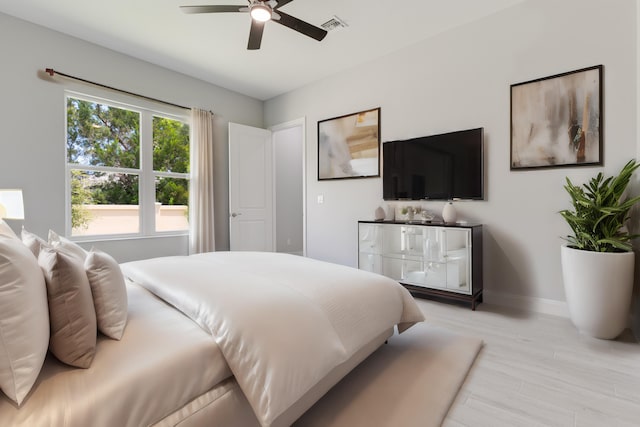 bedroom featuring ceiling fan and light hardwood / wood-style flooring