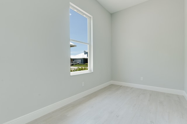 empty room with light hardwood / wood-style floors