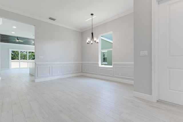 unfurnished room with light hardwood / wood-style floors, a notable chandelier, and ornamental molding