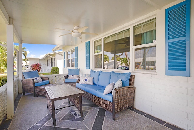 view of patio / terrace featuring ceiling fan and an outdoor living space