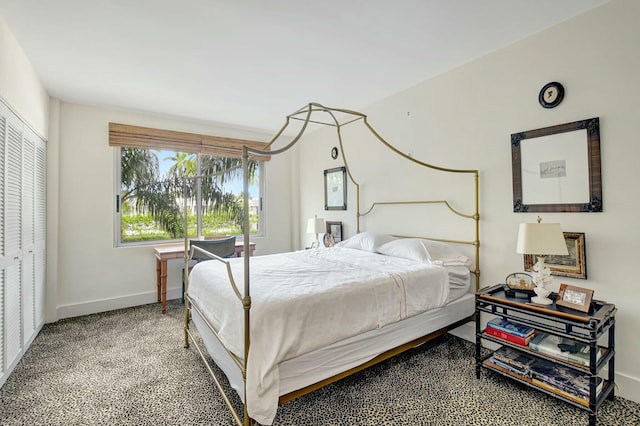 bedroom with carpet and a closet