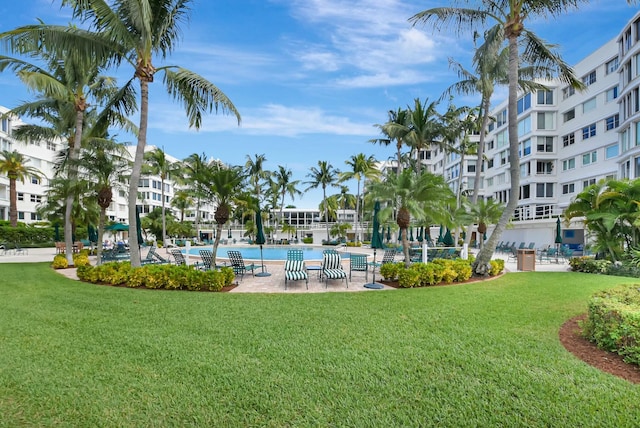 surrounding community featuring a yard and a swimming pool