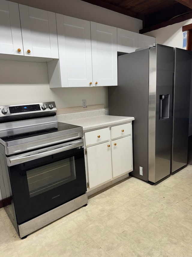 kitchen with white cabinetry and stainless steel appliances