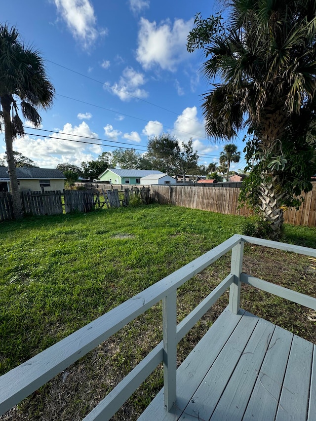 view of yard featuring a wooden deck