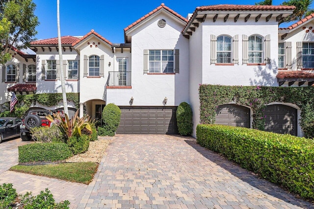 mediterranean / spanish-style home featuring a garage