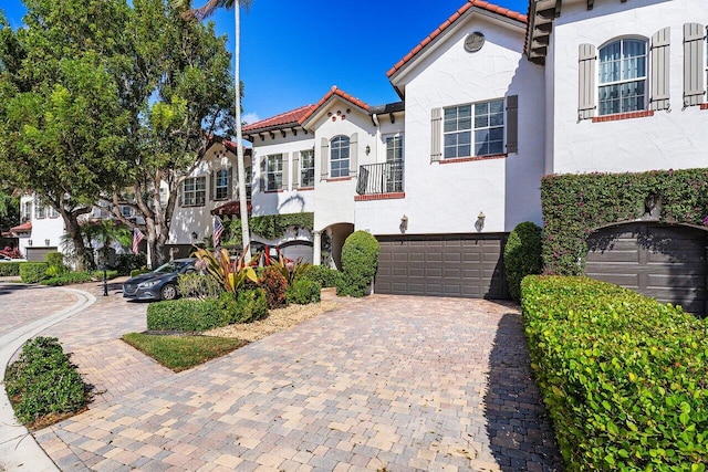 mediterranean / spanish house with a garage