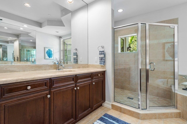 bathroom with vanity, walk in shower, and tile patterned flooring