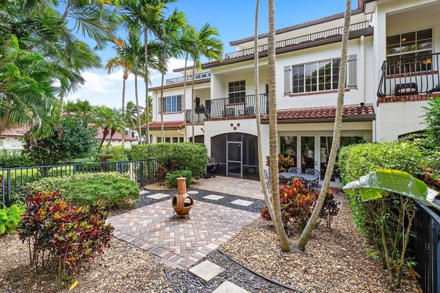 exterior space with a patio and a balcony