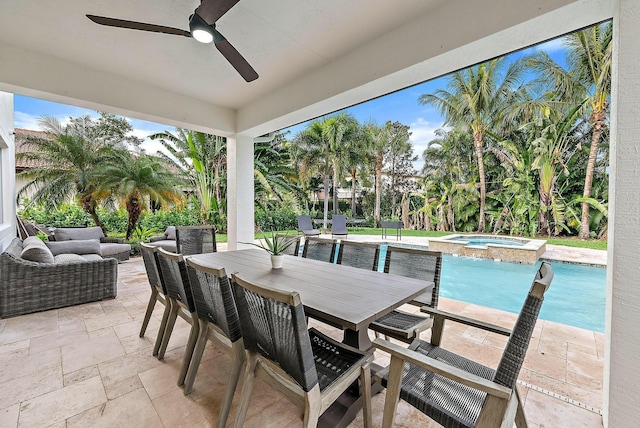 view of patio / terrace with ceiling fan and a swimming pool with hot tub