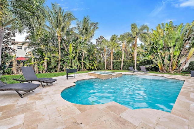 view of pool featuring an in ground hot tub and a patio