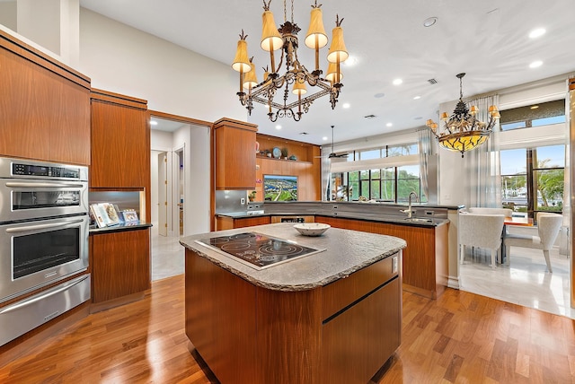 dining room featuring baseboards, light tile patterned flooring, a chandelier, and recessed lighting