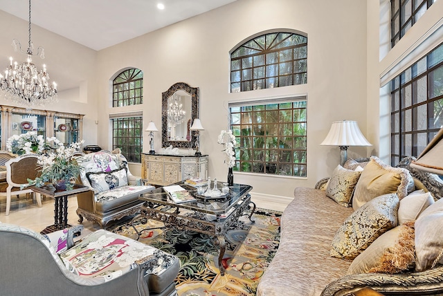 foyer entrance with a towering ceiling, baseboards, and french doors