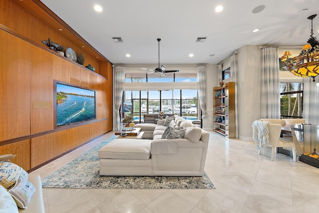 living area featuring a ceiling fan, recessed lighting, and light tile patterned flooring