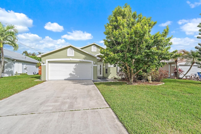 view of front of property with a front yard and a garage