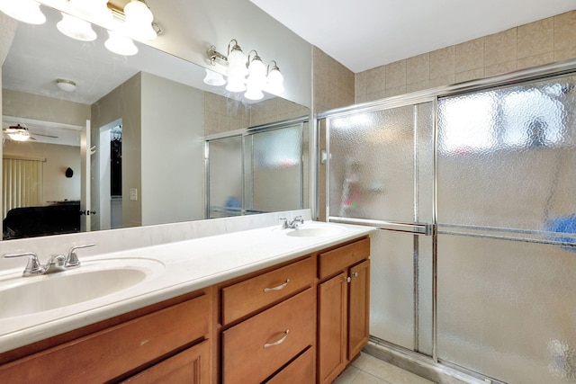 bathroom featuring vanity, tile patterned floors, ceiling fan, and a shower with shower door