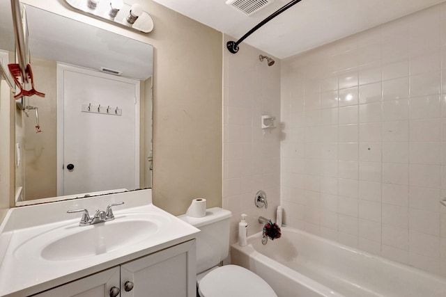 full bathroom with vanity, toilet, and tiled shower / bath