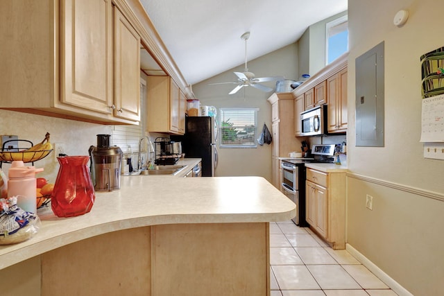 kitchen with kitchen peninsula, appliances with stainless steel finishes, light brown cabinetry, lofted ceiling, and electric panel