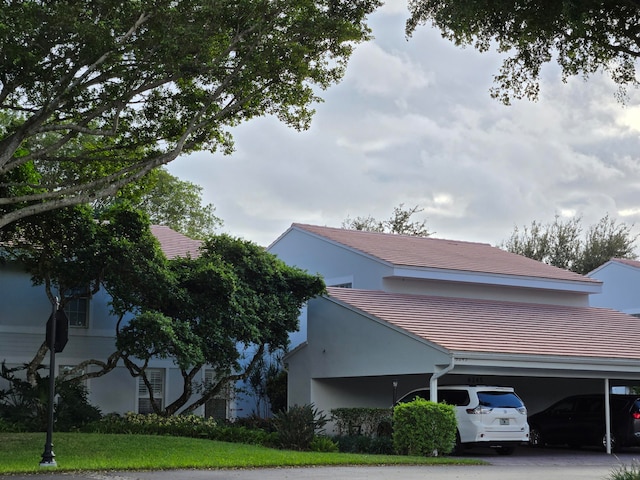 view of property exterior with a carport