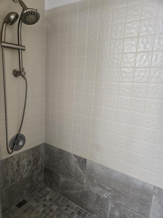 bathroom with tiled shower