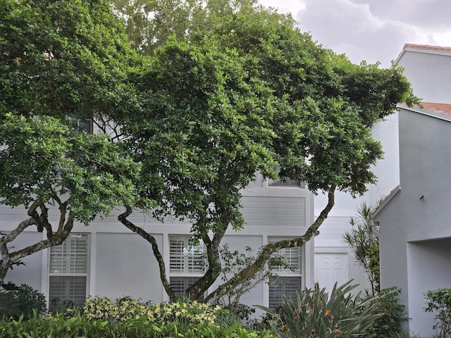 view of side of home featuring stucco siding