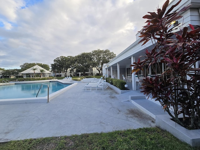 community pool featuring a patio area