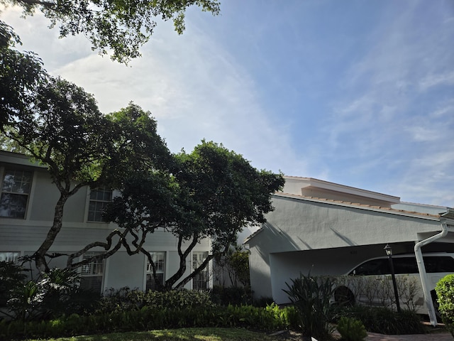 view of side of home featuring stucco siding