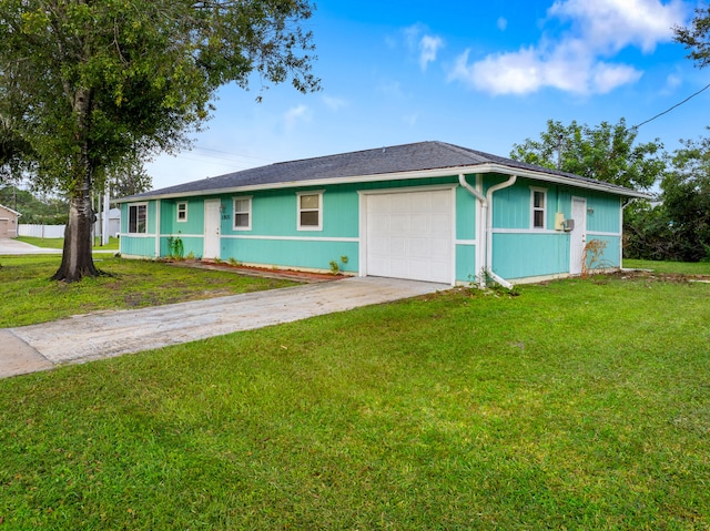 single story home featuring a garage and a front yard