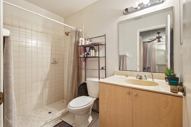 bathroom with vanity, a shower with shower curtain, tile patterned flooring, toilet, and ceiling fan